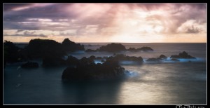 Long exposure seascape at sunrise with rock stacks in the ocean on Maui.