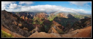Waimea Canyon in late afternoon light with rainbow and waterfall