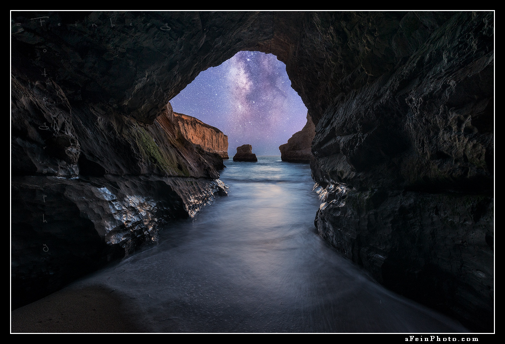 Milky way as seen through a sea cave along the California coast north of Santa Cruz