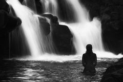 black and white fine art landscape nude silhouette in waterfall Ho'opi'i Falls, Kauai, Hawaii 