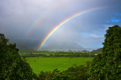 hawaiian landscape of rainbow over Hanalei Bay, Kaua'i, Hawai'i