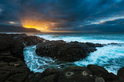 Seaside photography at sunset Queens Bath in Princeville, Kauai, Hawaii