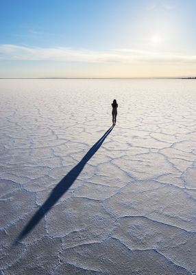 Artistic figure study poses at sunrise at Bonneville Salt Flats, Utah.