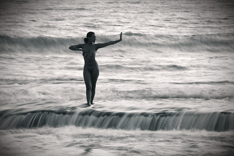 black and white fine art landscape nude woman dancing in waves, Moloa'a Bay, Kauai, Hawaii 