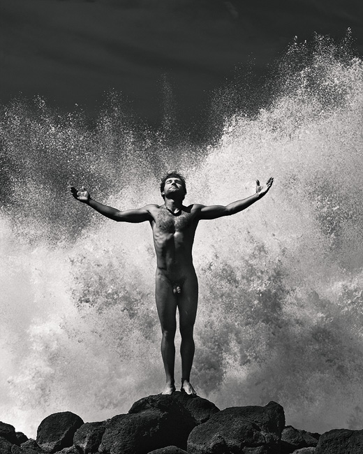 masculine black and white fine art landscape male nude in ocean spray Princeville, Kauai, Hawaii 