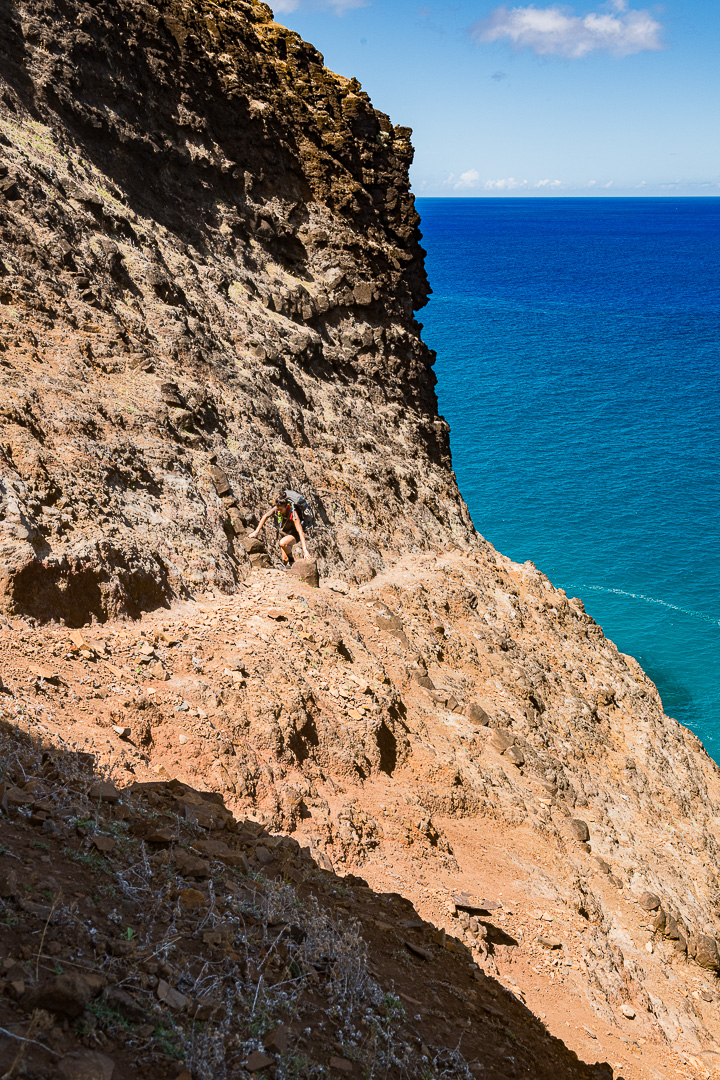 The iconic 'crawler's ledge' section of the Kalalau Trail along the Na Pali Coast.